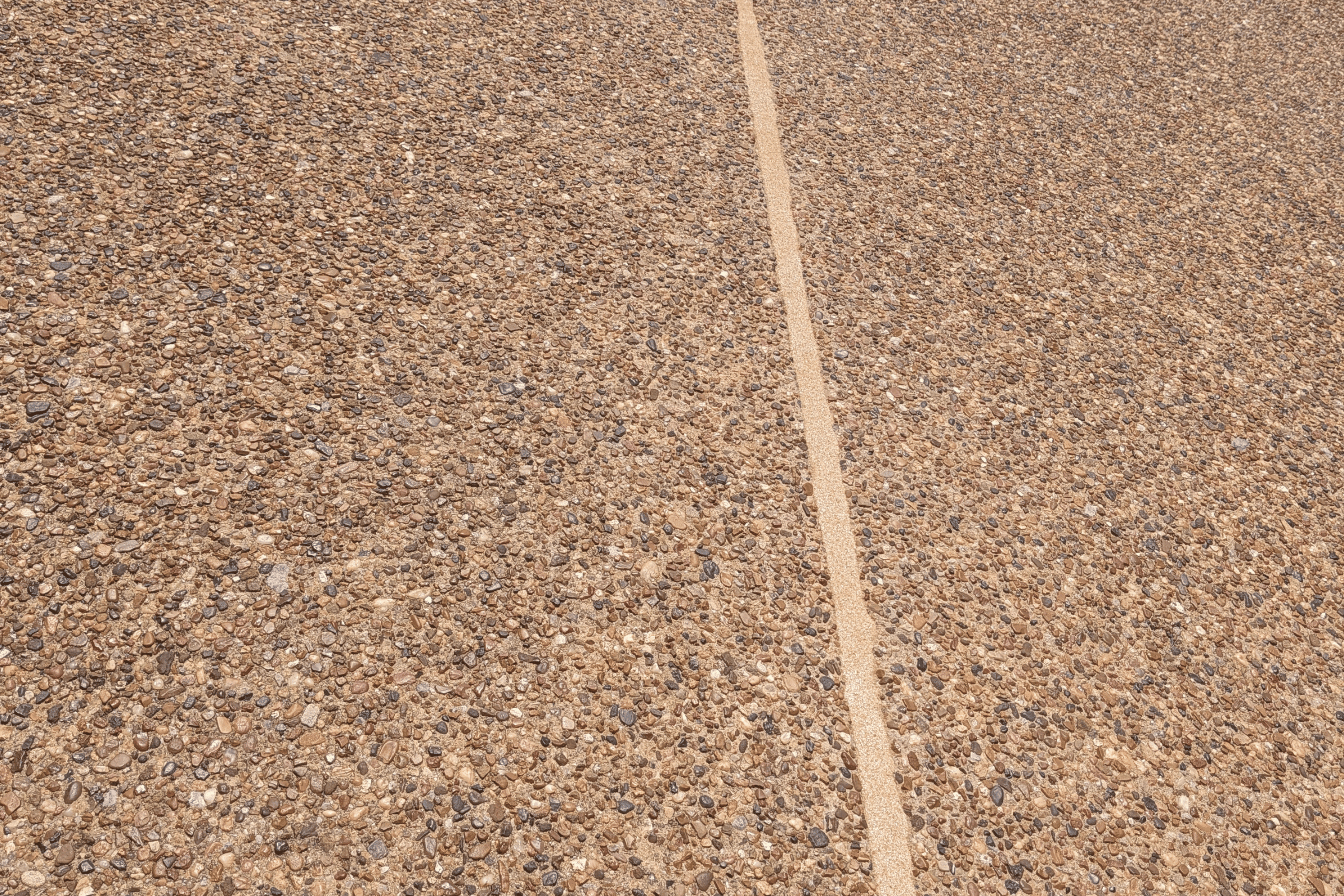 Driveway expansion joint sealing example with a clean finished joint line