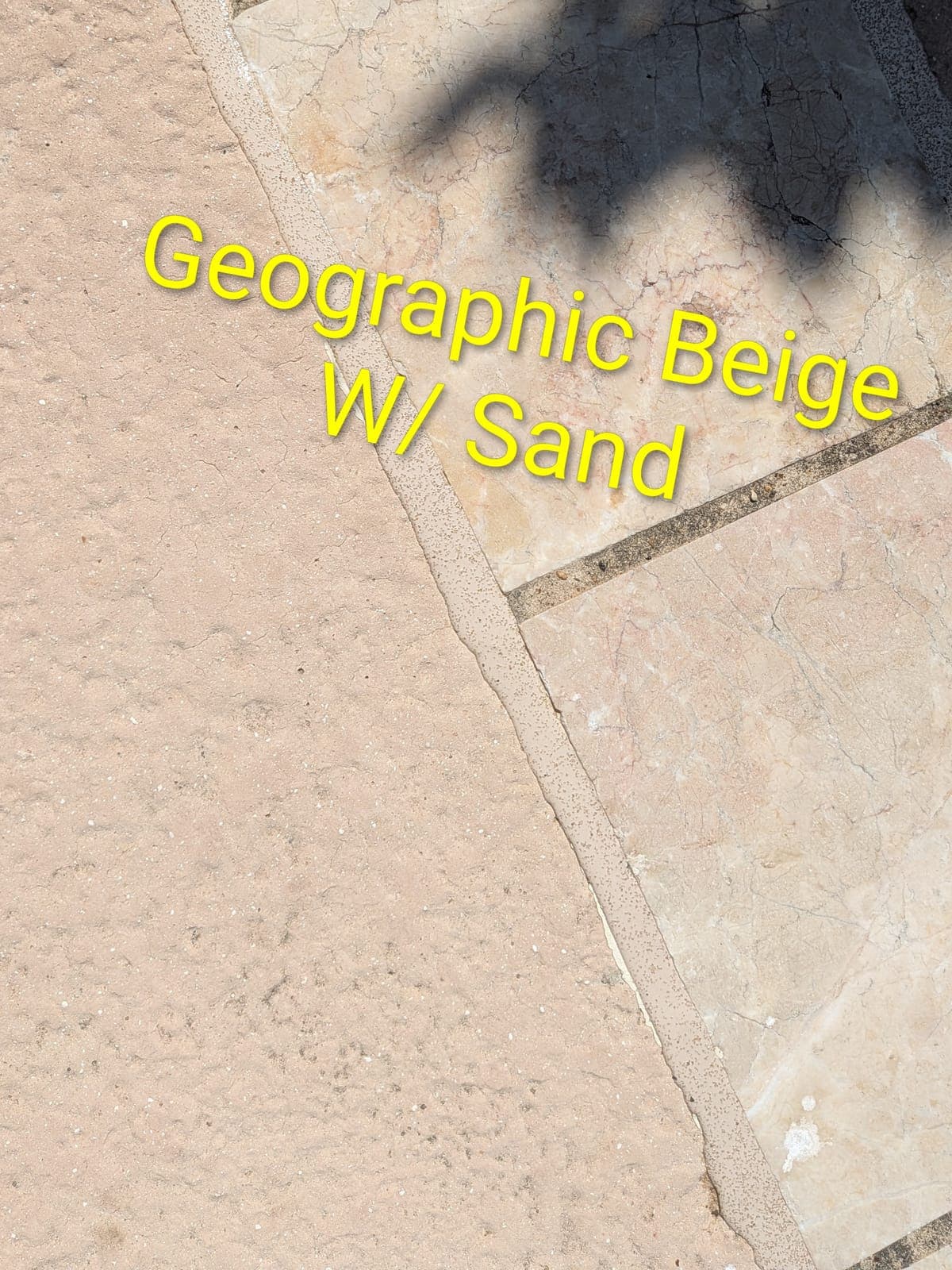 Sika Geographic Beige with Sand pool mastic sealant color example on a travertine coping and textured concrete pool deck — textured sand finish