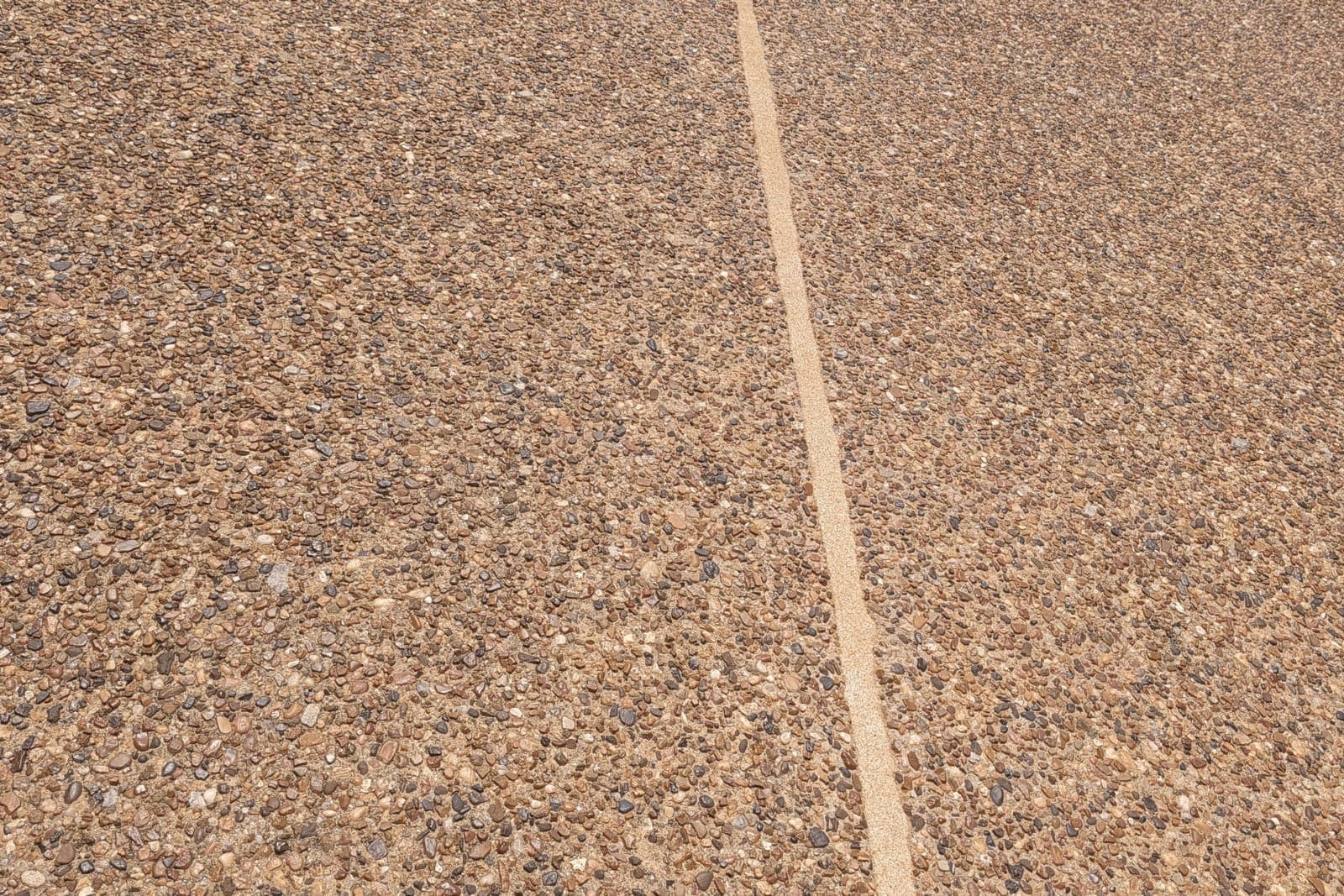 Driveway expansion joint sealing example with a clean finished joint line
