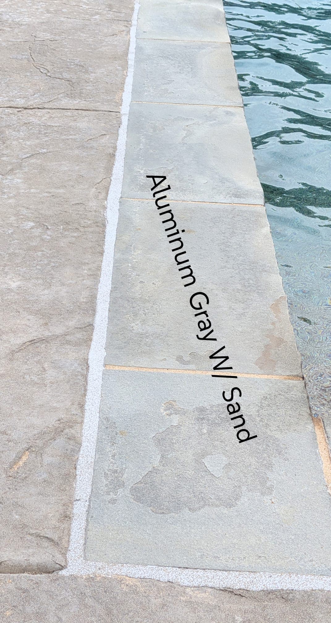 Sika Aluminum Gray with Sand pool mastic sealant color example — textured sand finish