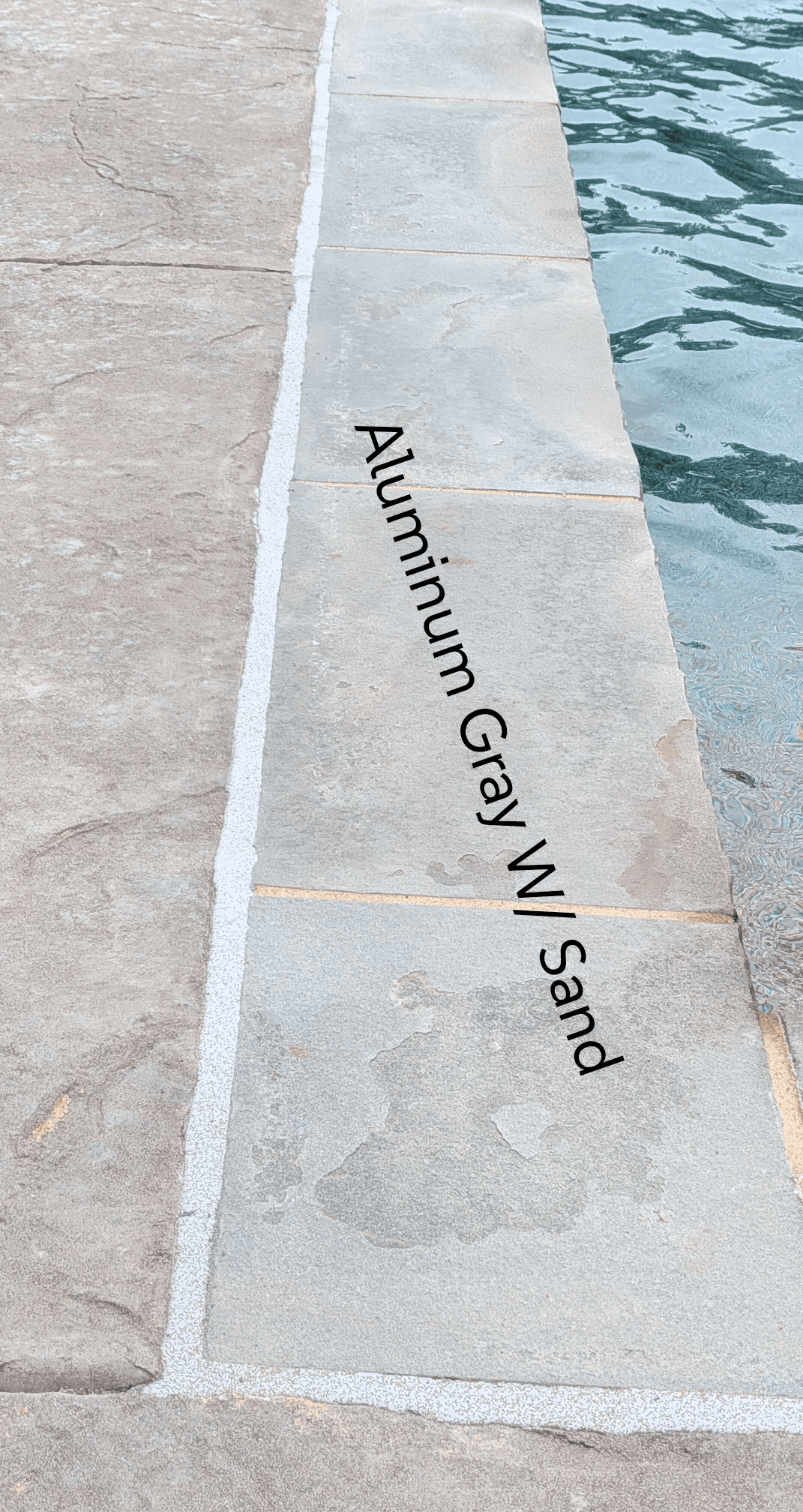 Sika Aluminum Gray with Sand pool mastic sealant color example — textured sand finish